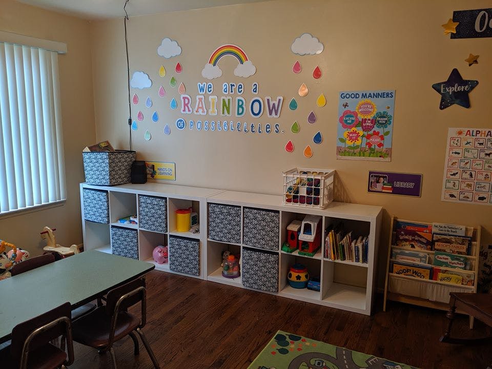 Classroom with storage cubbies, children's table, and wall decorations