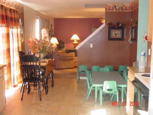 Dining room with adult table and chairs, and child-sized table and chairs