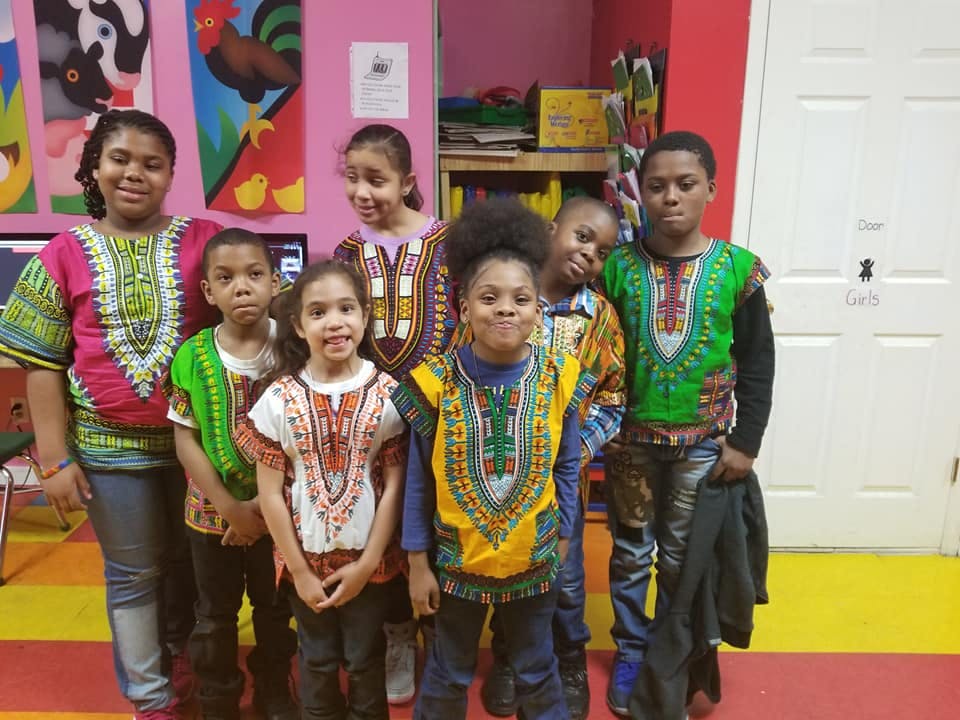 Group of children wearing colorful dashikis