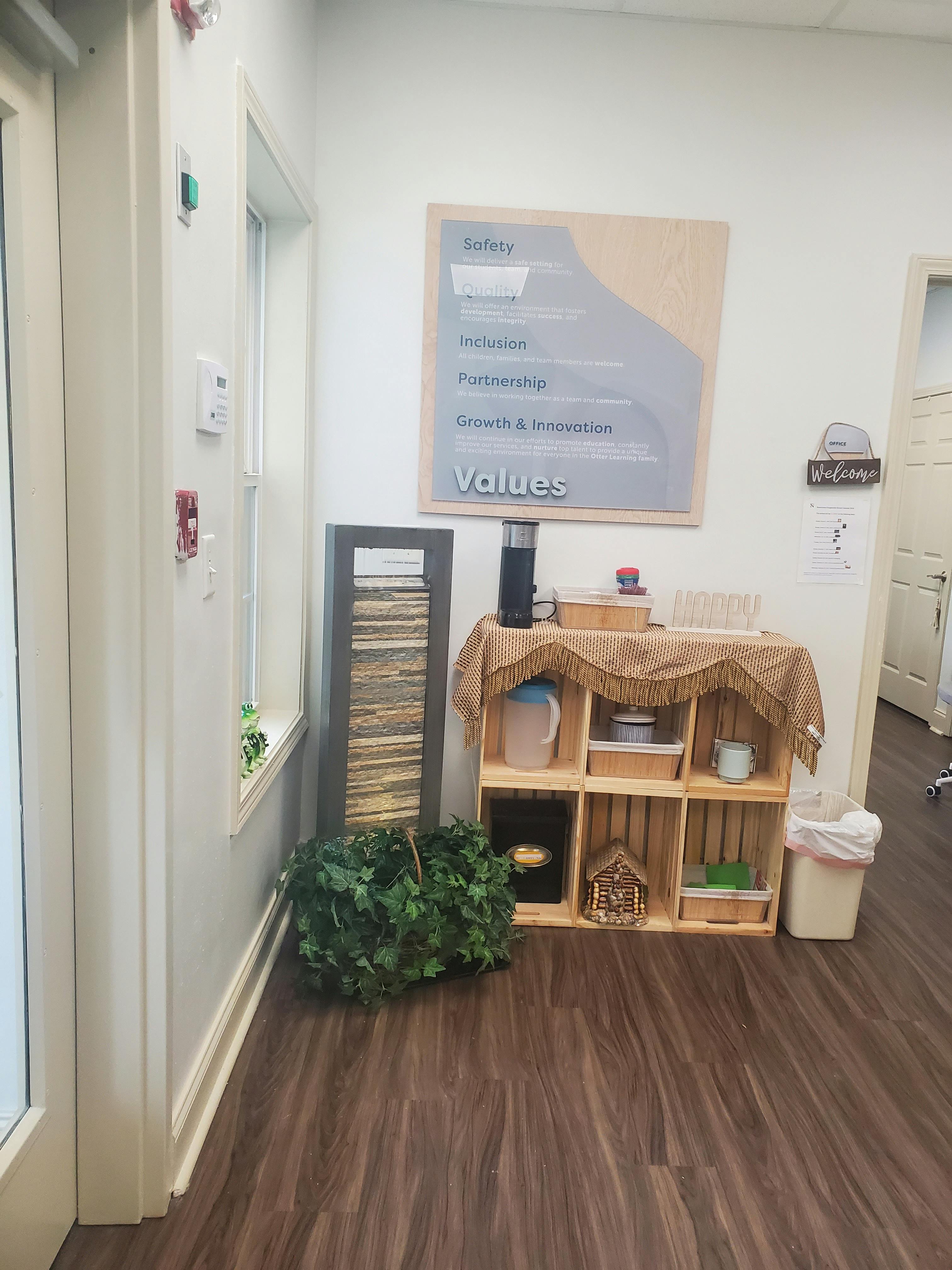 Wall with a 'Values' sign listing Safety, Inclusion, Partnership, Growth & Innovation