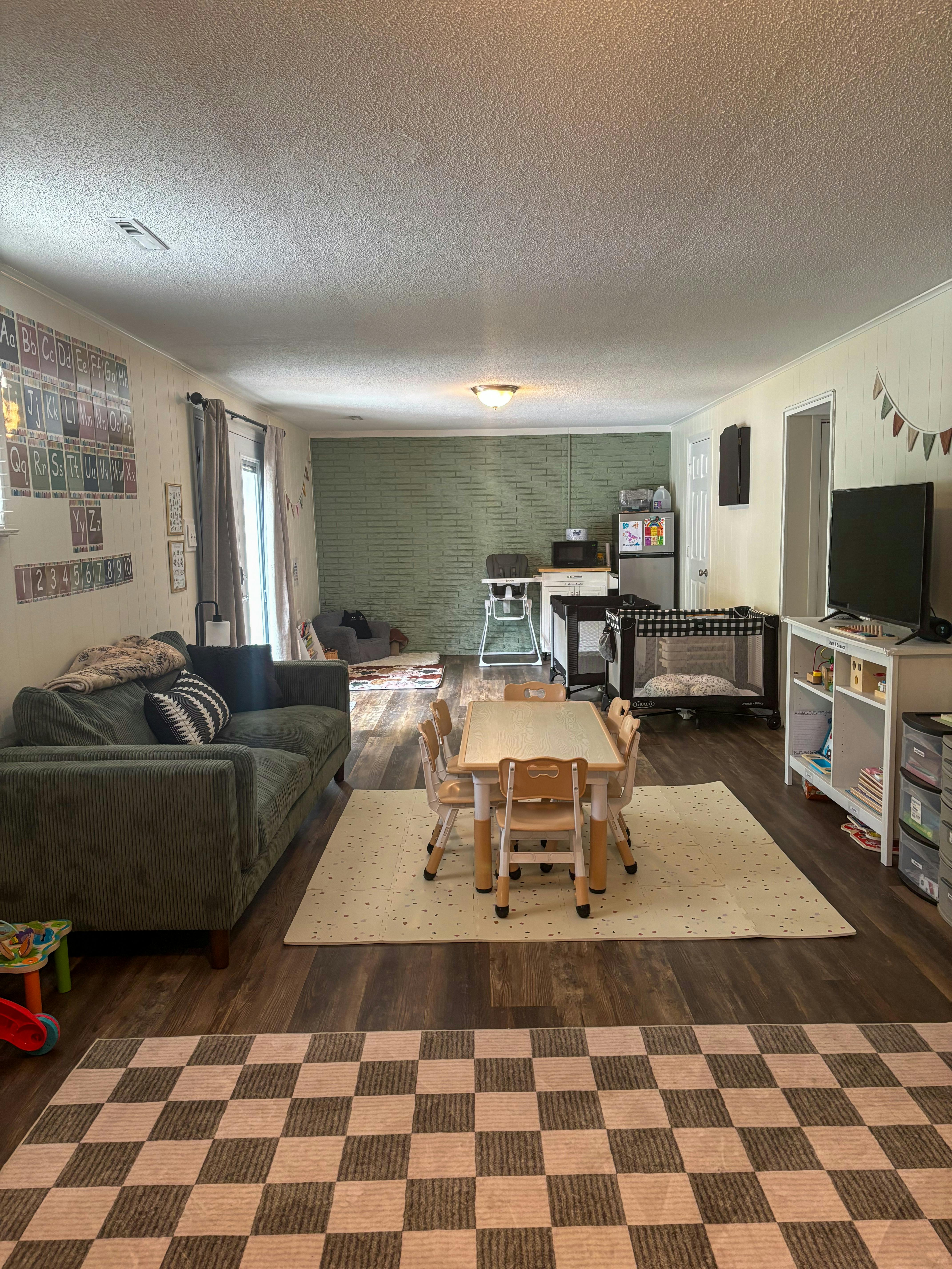 Childs playroom with a small table and chairs set in the center