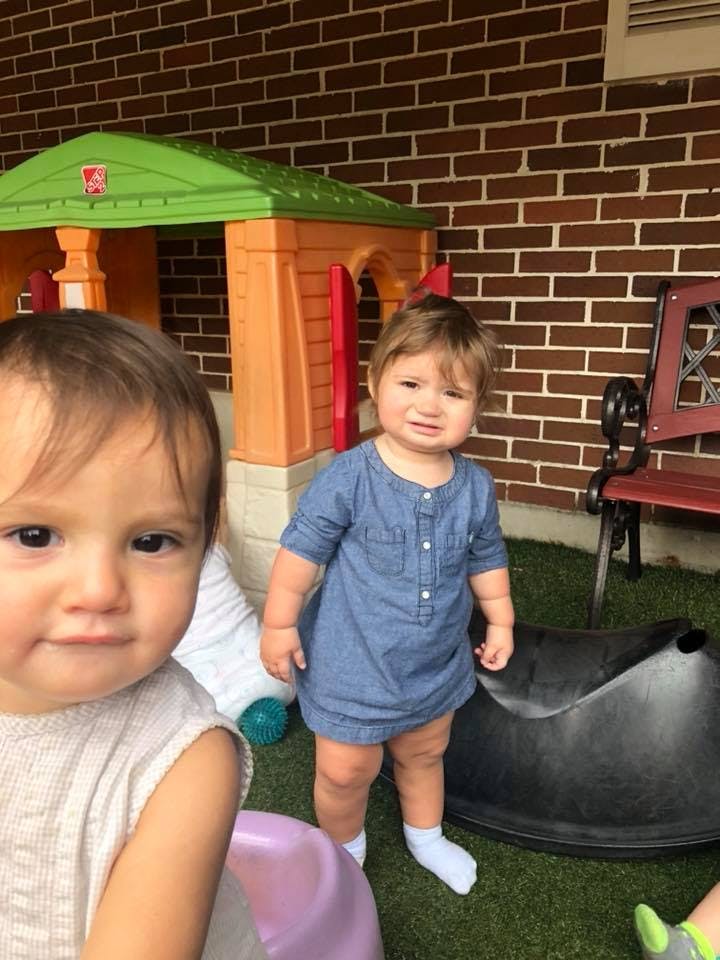 Two children in an outdoor play area