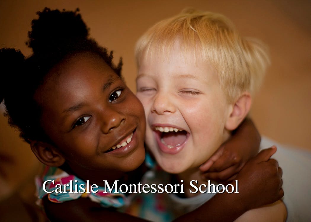 Two children hugging and laughing