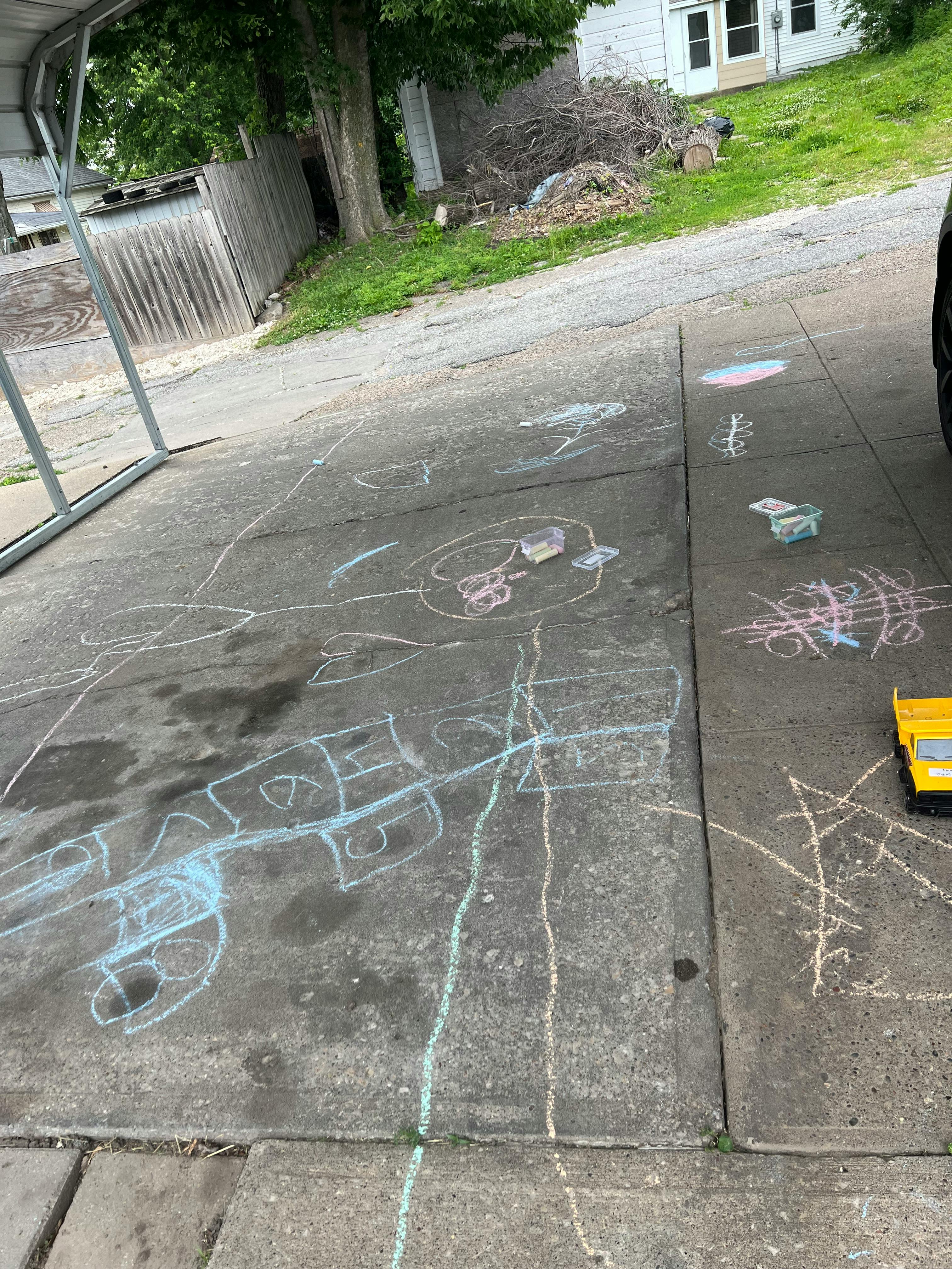 Chalk drawings on a concrete driveway