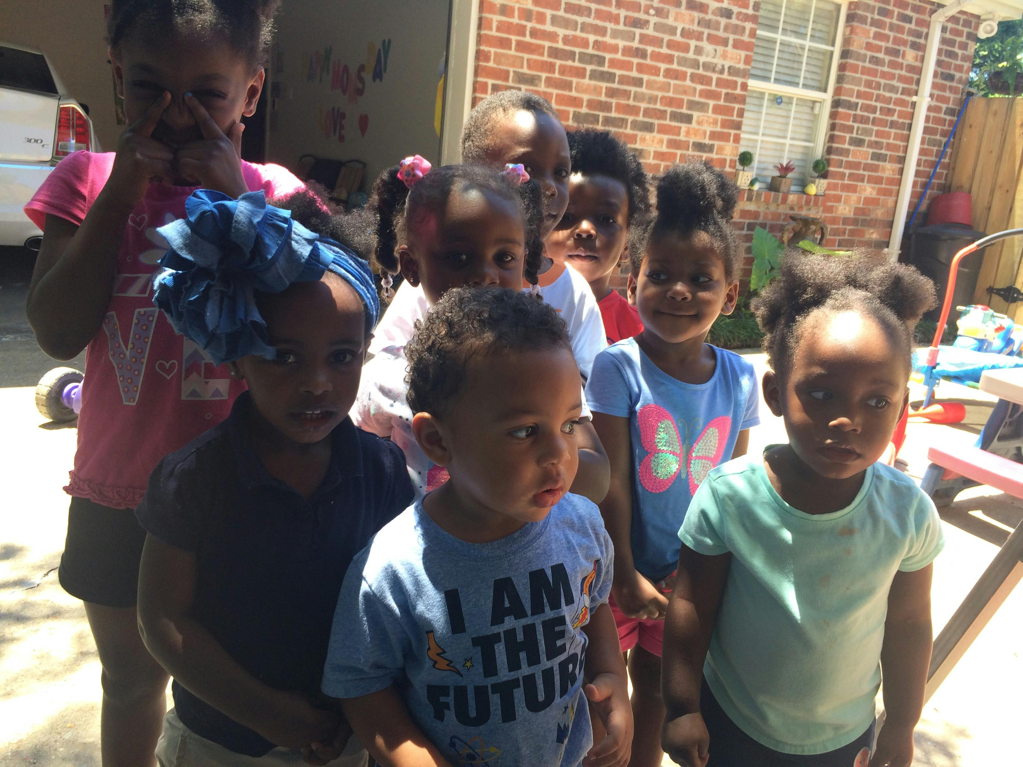 Group of children standing together outdoors