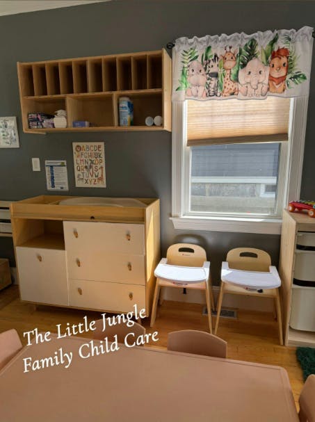 Changing table with shelves, window with valance, and two high chairs