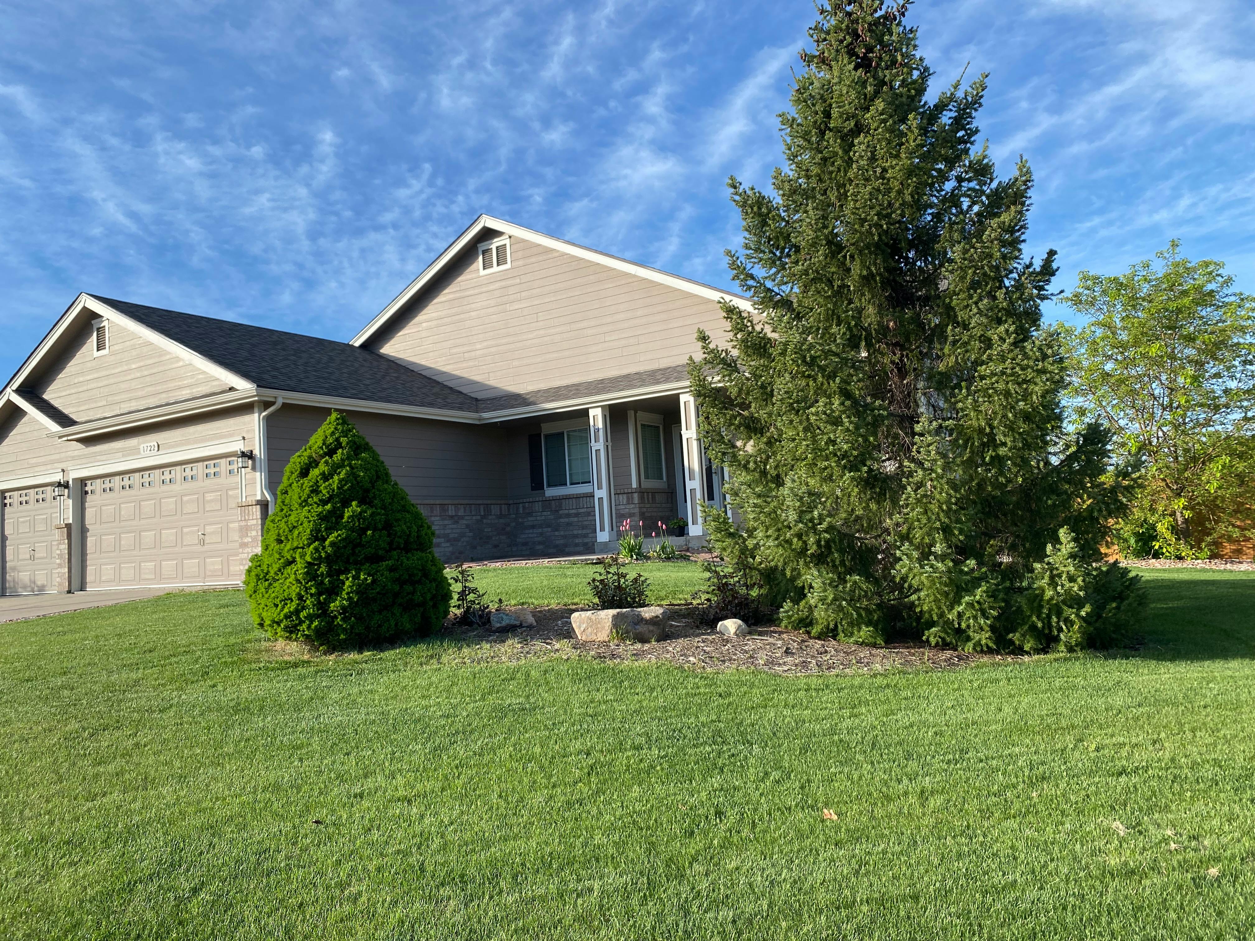 House with a two-car garage and a large front yard