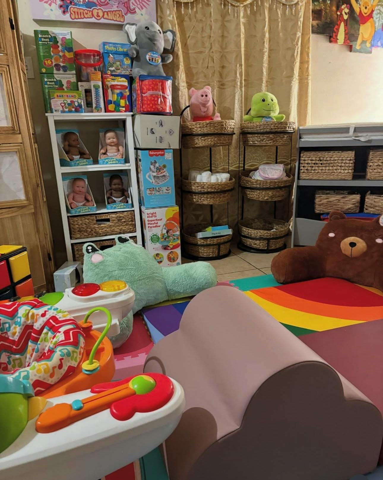 Playroom with toys, shelves, and a rainbow rug