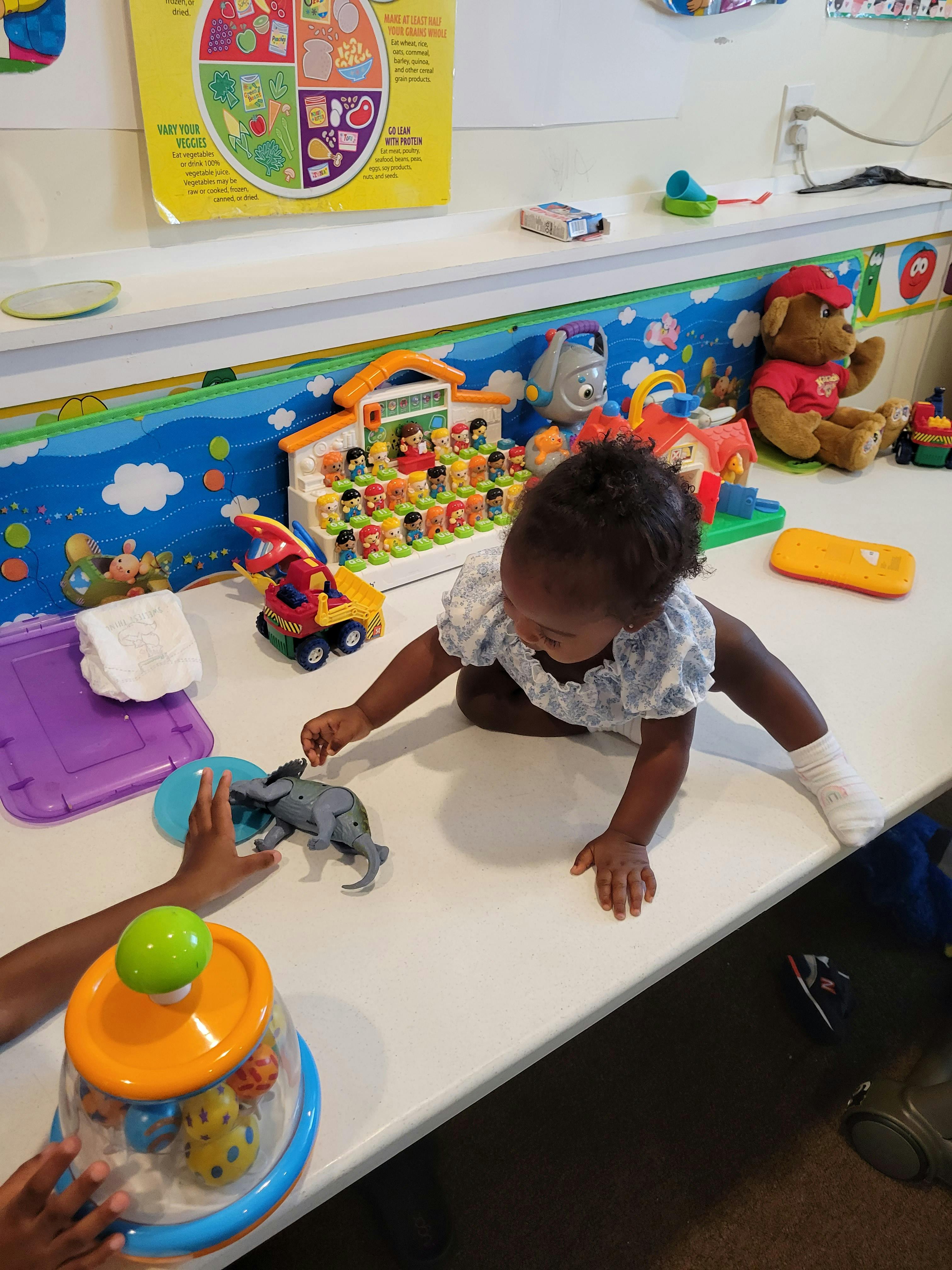 Child playing with toys on a table