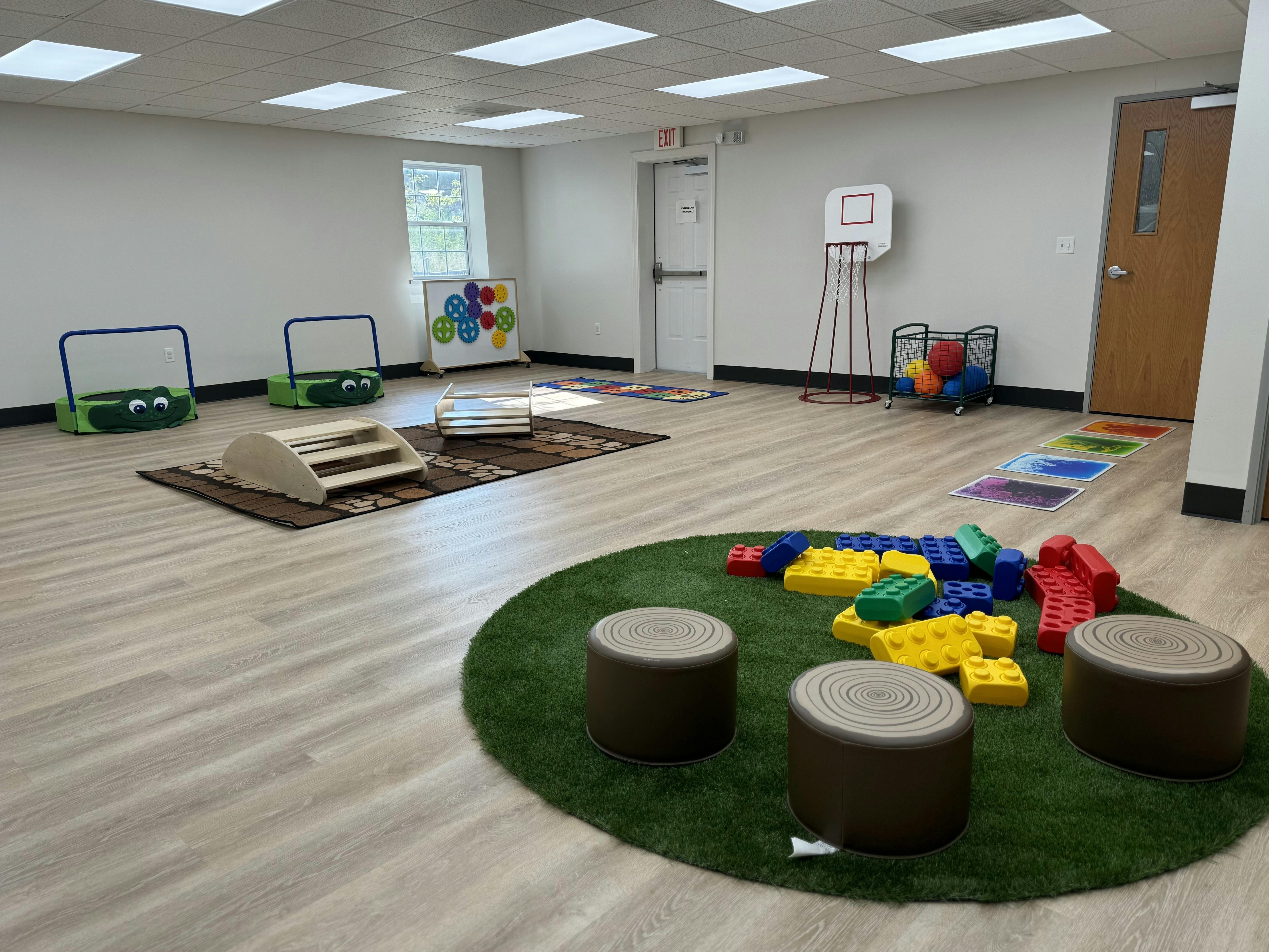 Empty children's play area with various toys and equipment