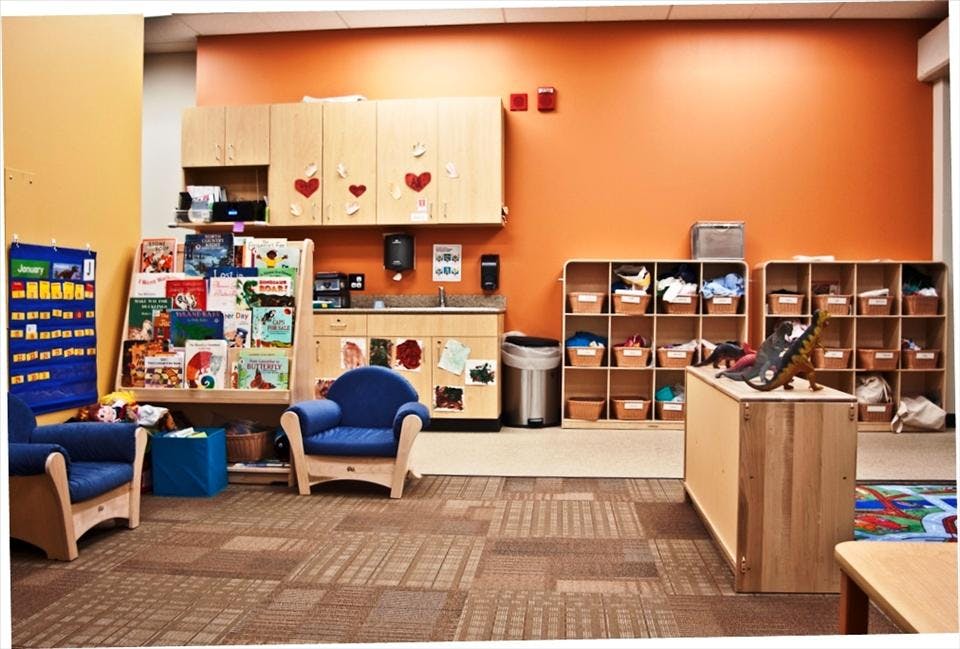 Classroom with child-sized furniture, books, and storage cubbies