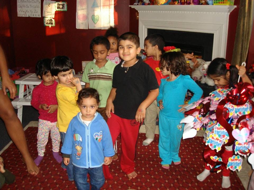 Group of children standing in a room