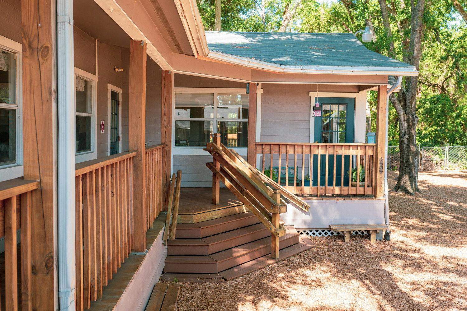 Exterior of a building with a wooden porch and steps