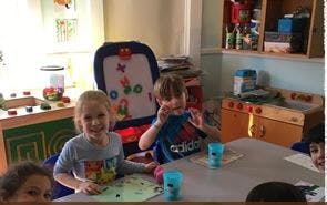 Two children sitting at a table