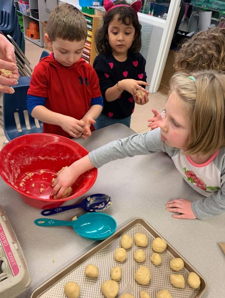 Children making cookie dough balls