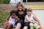 Adult and two children sitting together