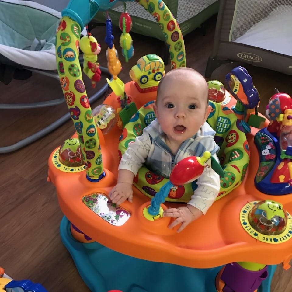 Child in a colorful activity center