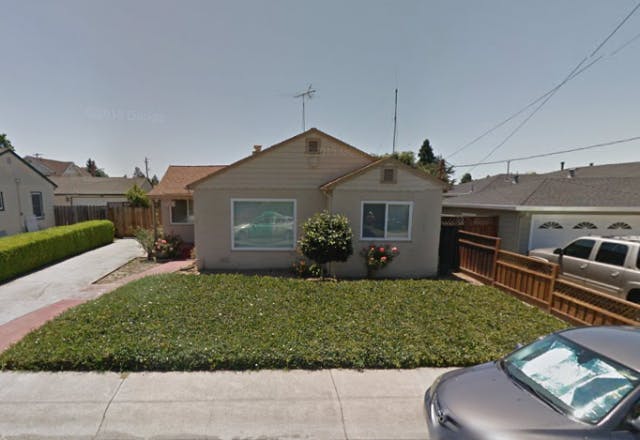 Single-story house with a front yard and driveway