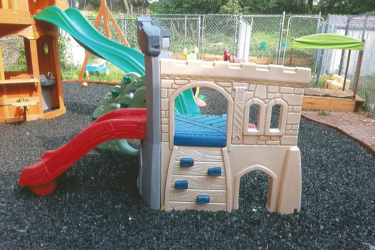 Playground with slides and a castle-shaped play structure