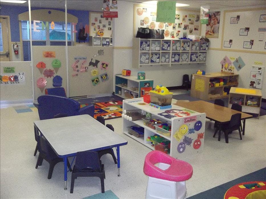 Classroom with small tables, chairs, and learning materials