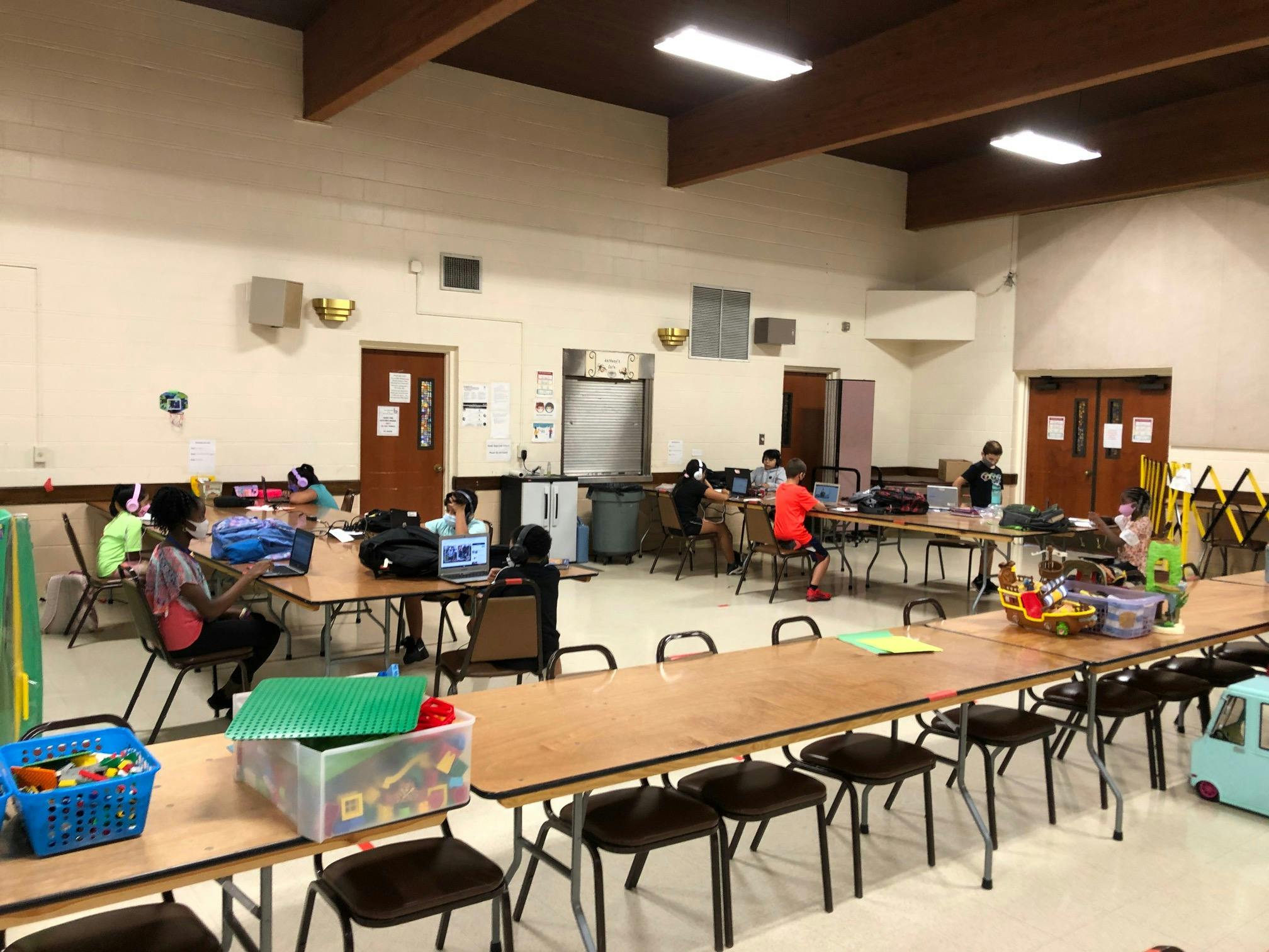 People sitting at tables in a large room