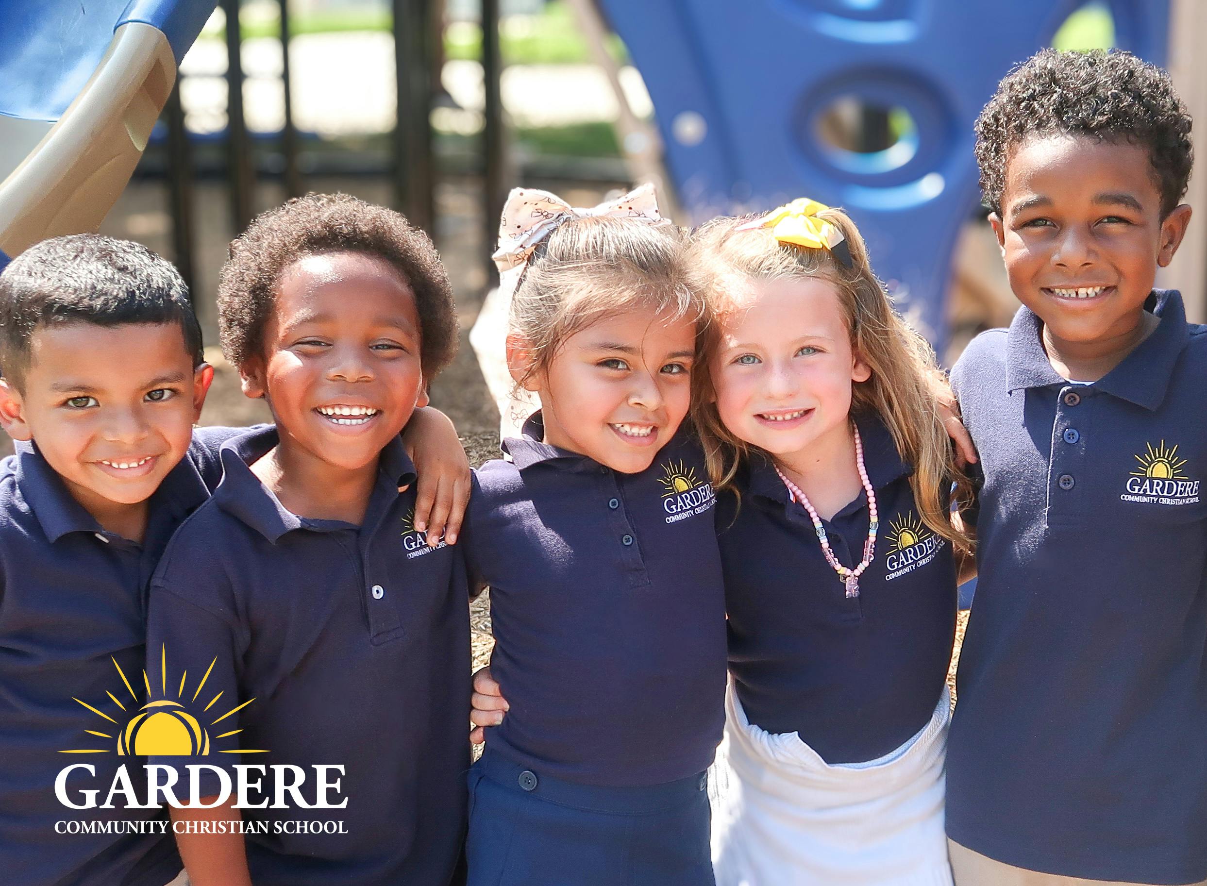 Five children in uniform standing together outdoors