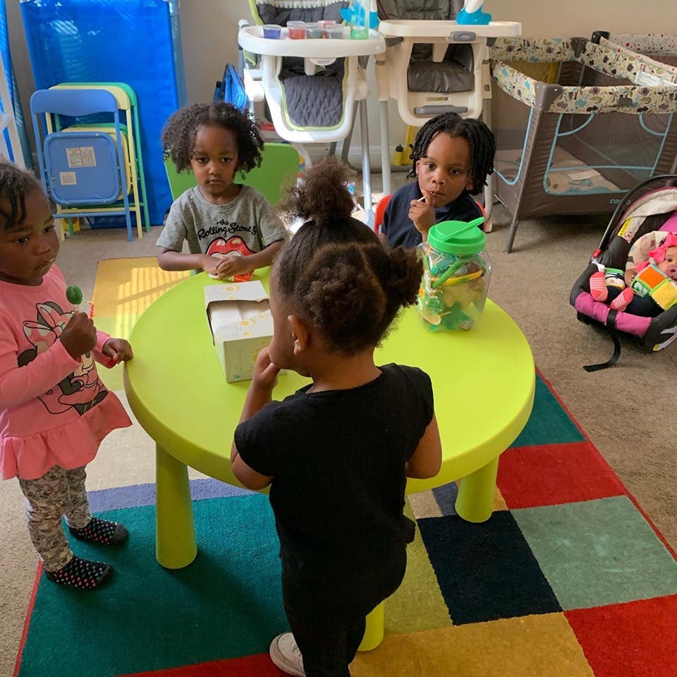 Children gathered around a small table