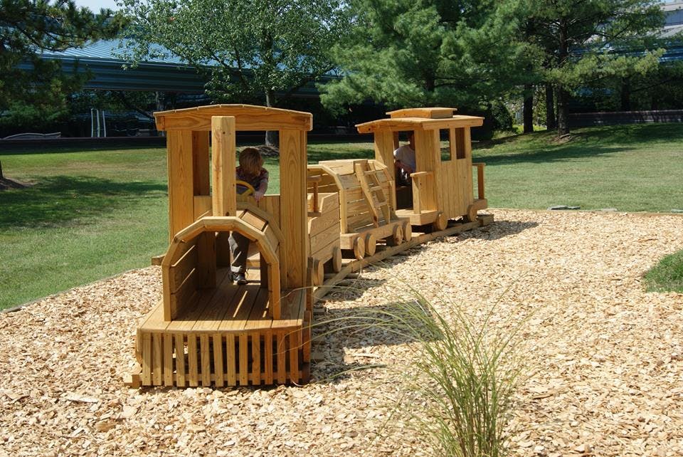 Wooden play train on wood chips