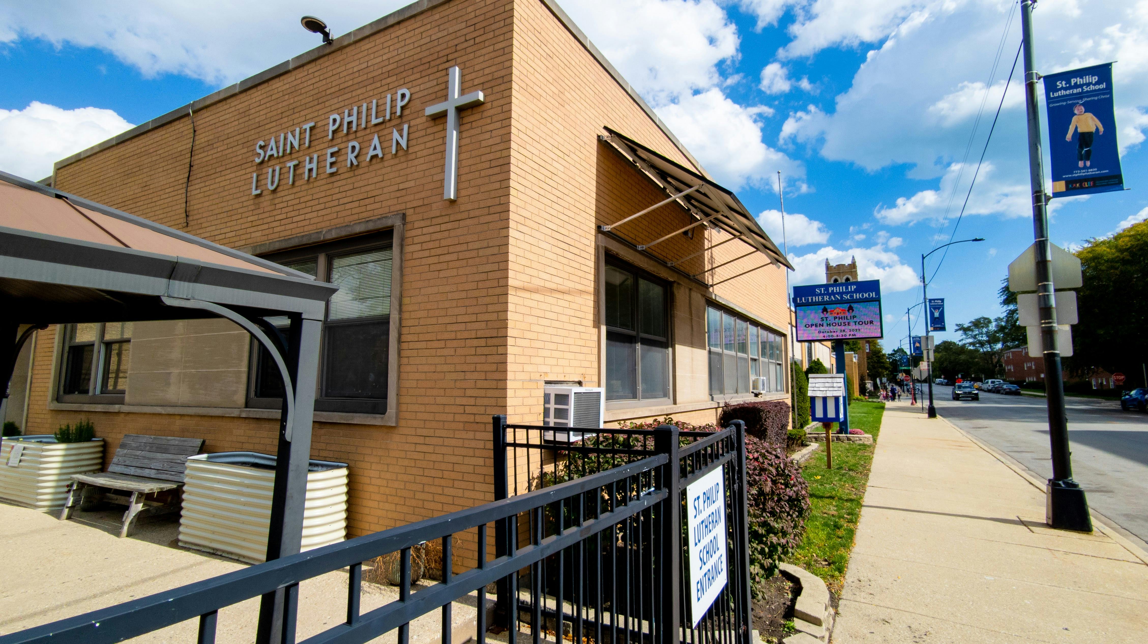 Saint Philip Lutheran church building with a cross on the facade