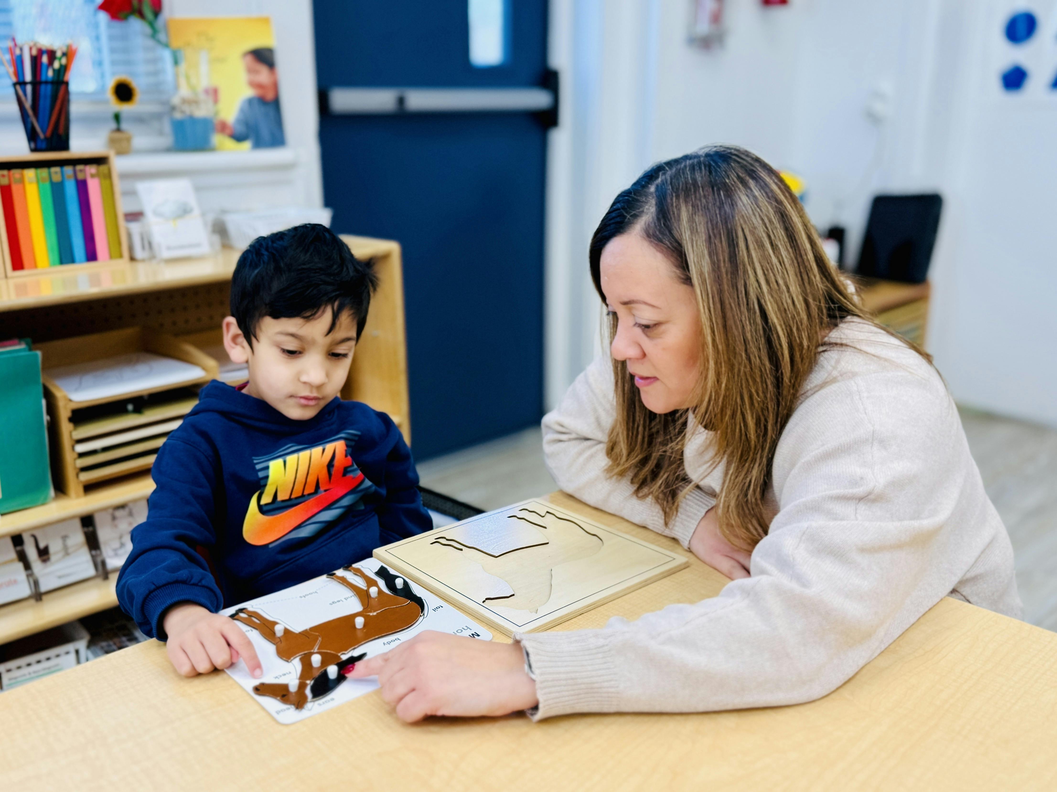 Adult and child working on a horse puzzle together