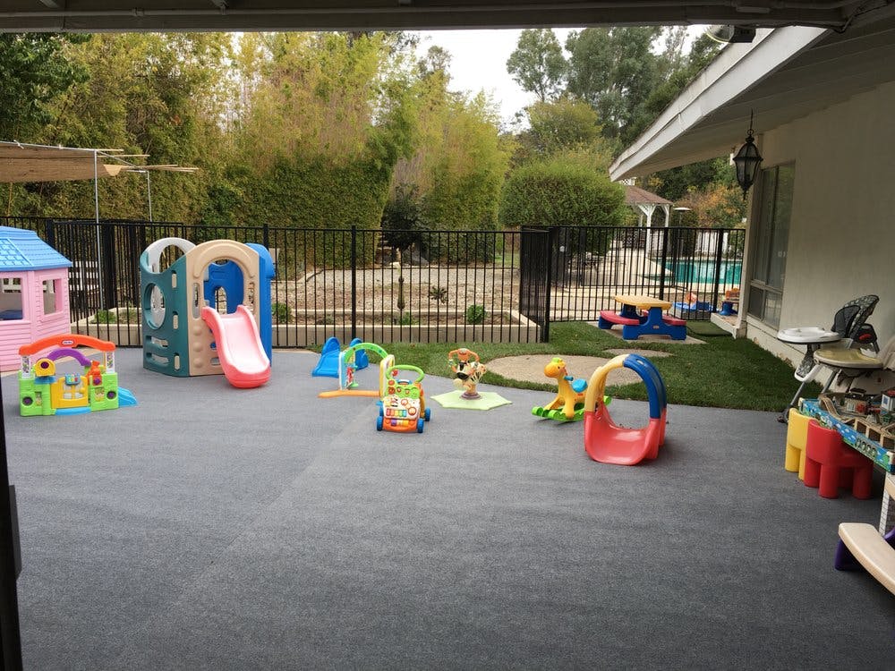 Outdoor play area with various colorful child toys and play structures