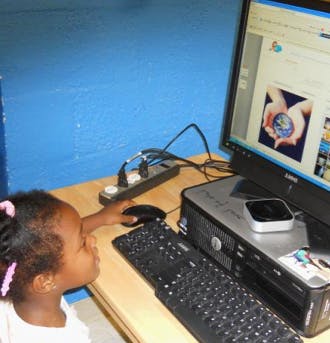 Child using a computer mouse