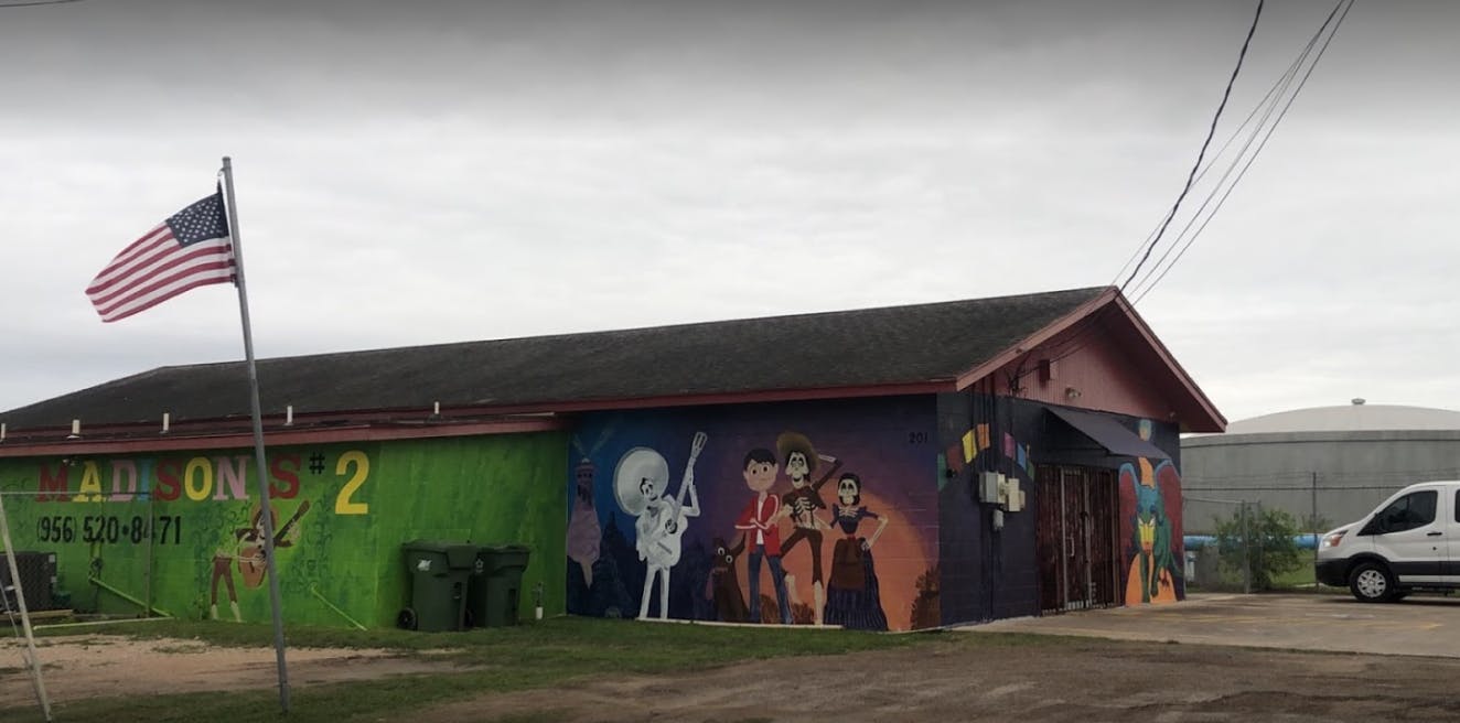Building with a mural and an American flag