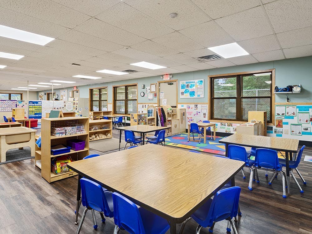 Empty classroom with tables and chairs