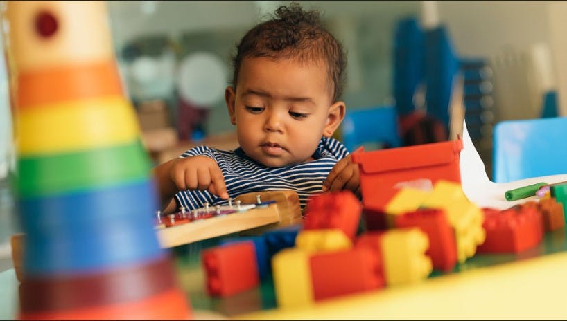 Child playing with an abacus