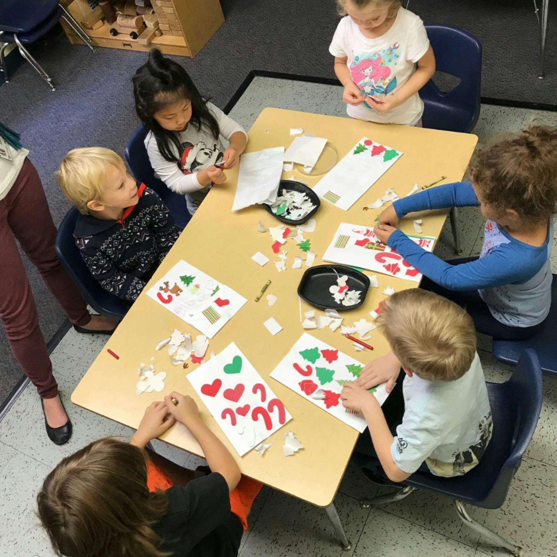 Children making crafts at a table