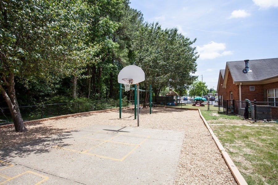Outdoor basketball court with a hoop and backboard