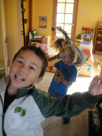 Child in foreground, other children in background
