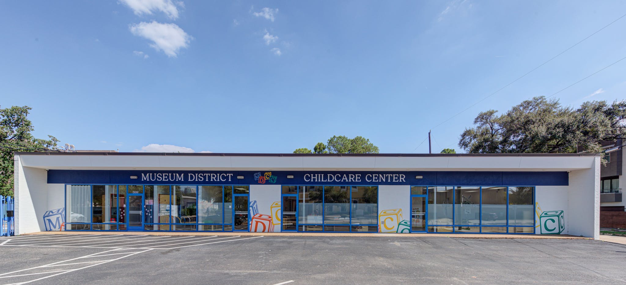 Museum District Childcare Center building exterior with large windows