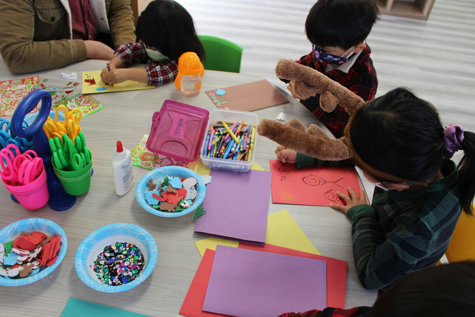 Children doing crafts at a table