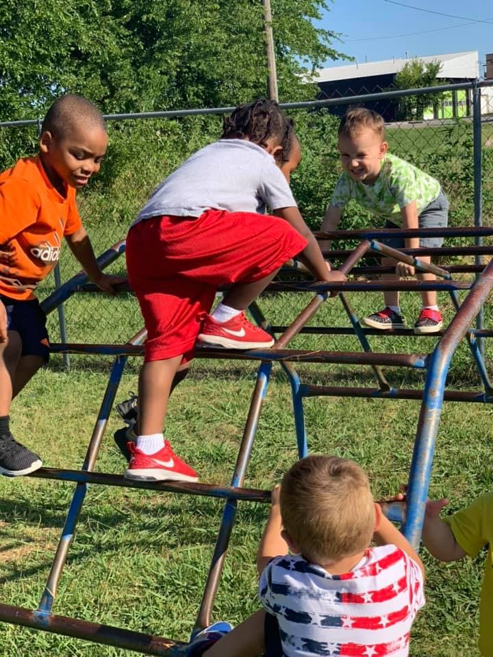 Children climbing on playground equipment