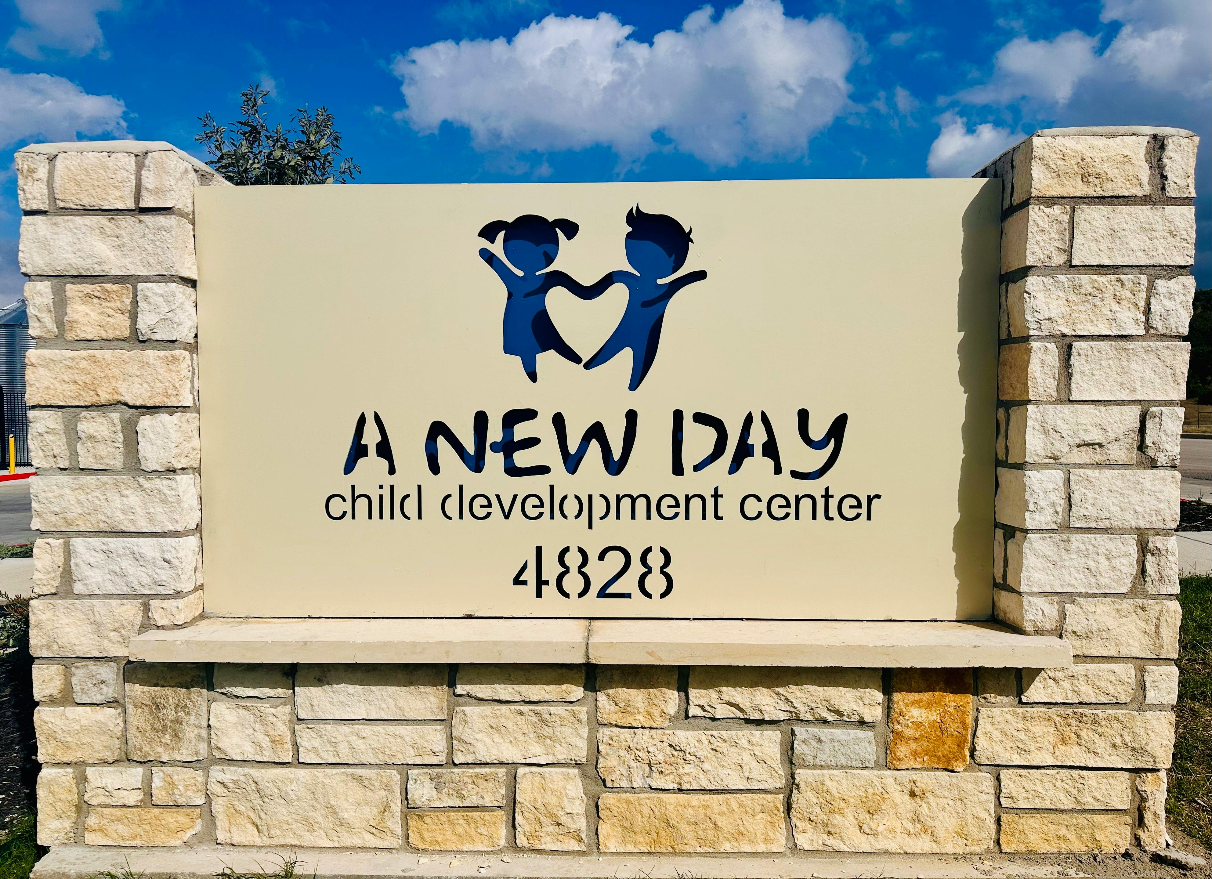 Stone sign for A New Day Child Development Center 4828