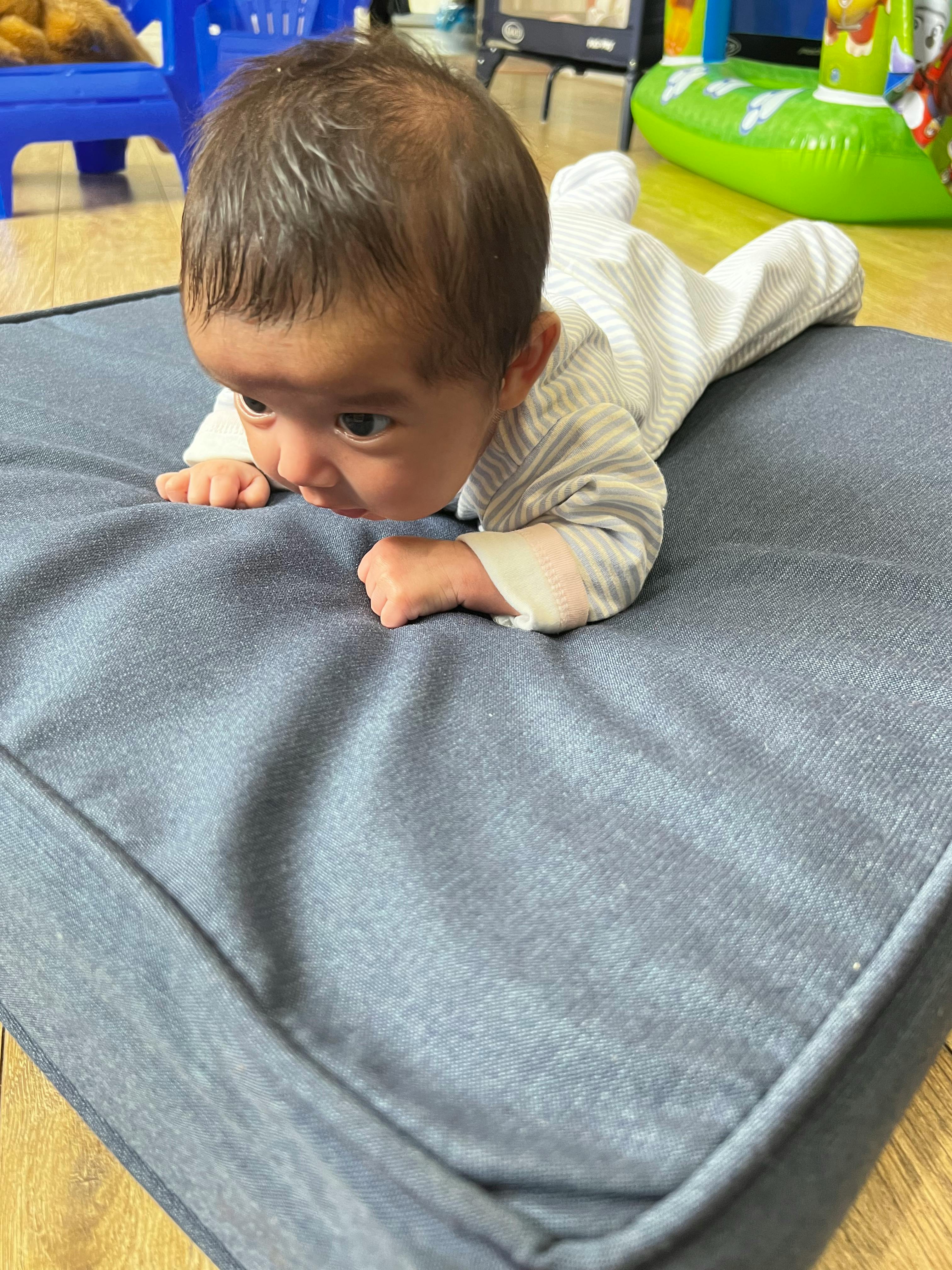 Child on stomach doing tummy time