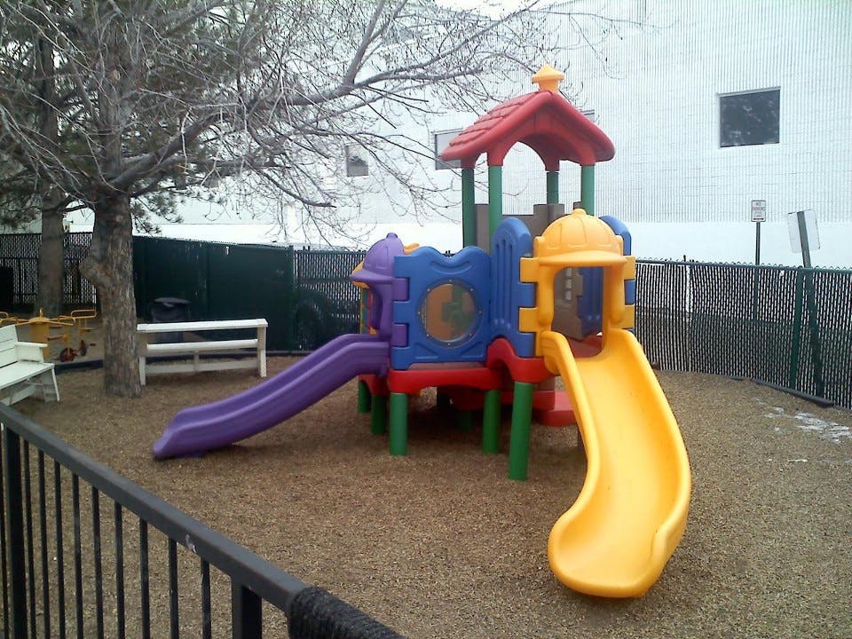 Colorful playground structure with two slides