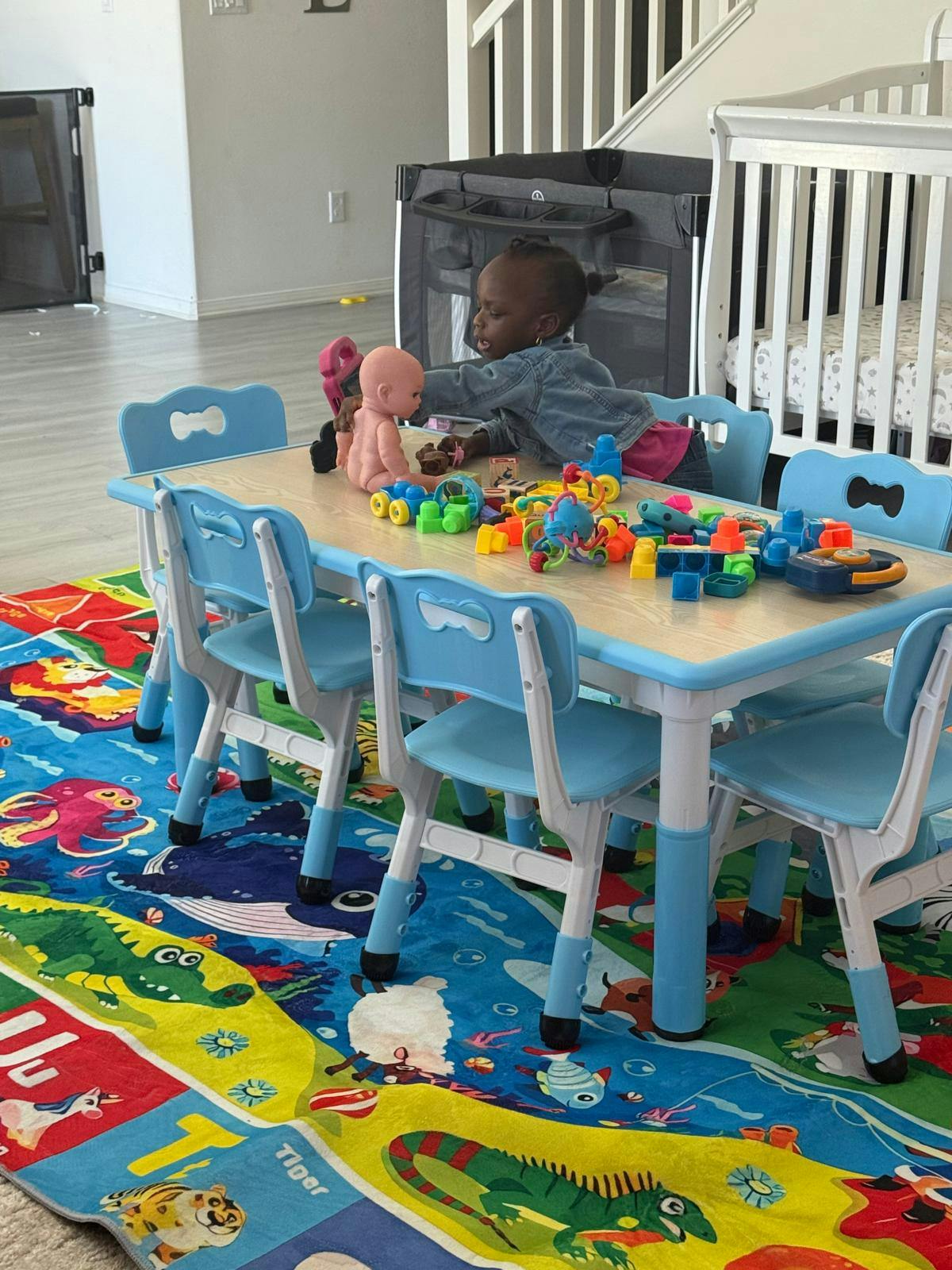 Child playing with toys at a small table