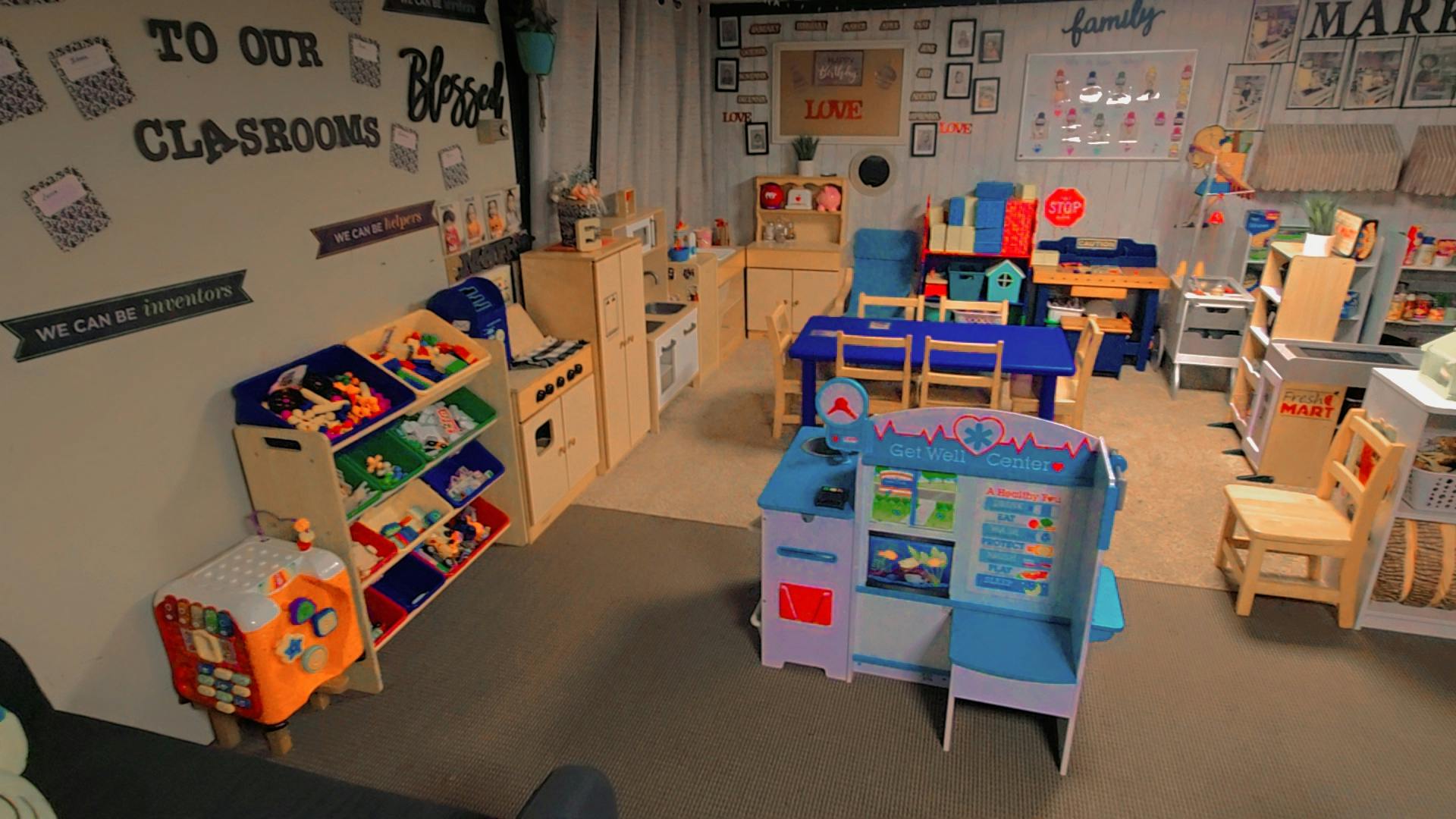 Playroom with various toy furniture and storage units