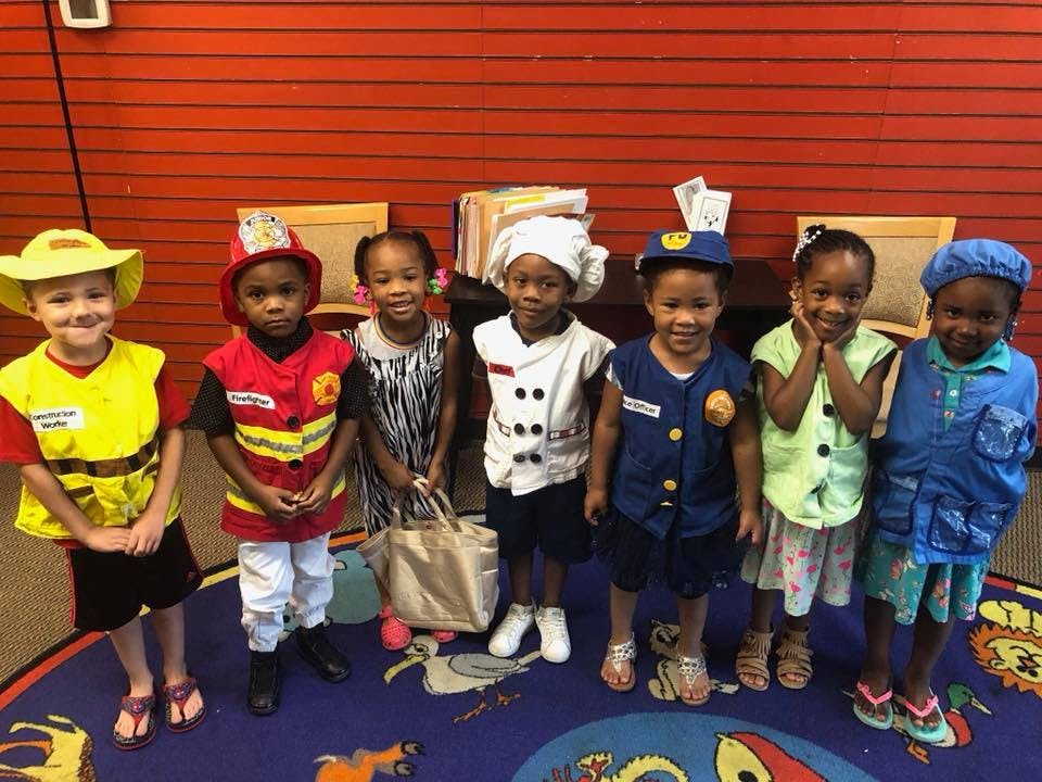 Six children in various career costumes