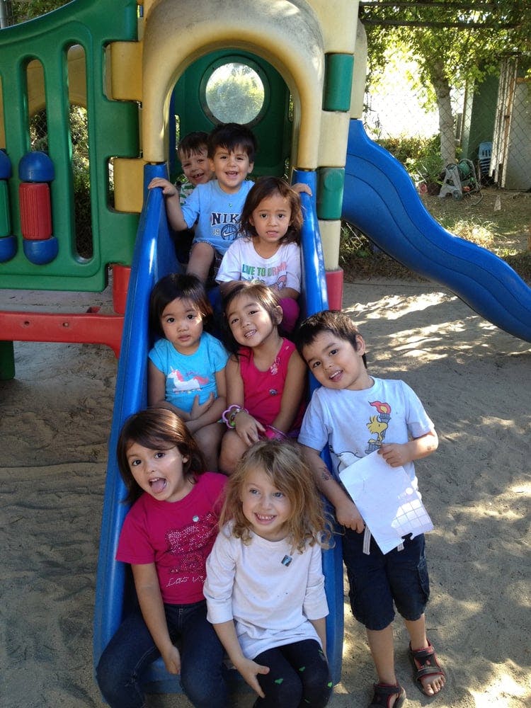 Group of children on a playground slide