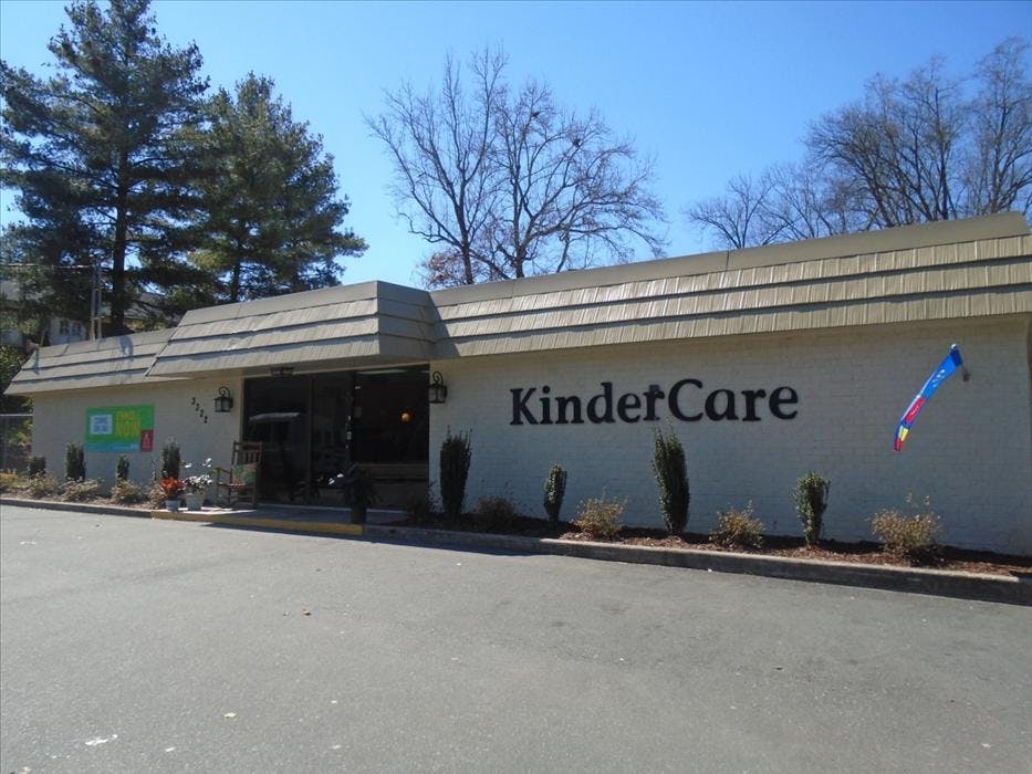 KinderCare building with white brick and a brown roof