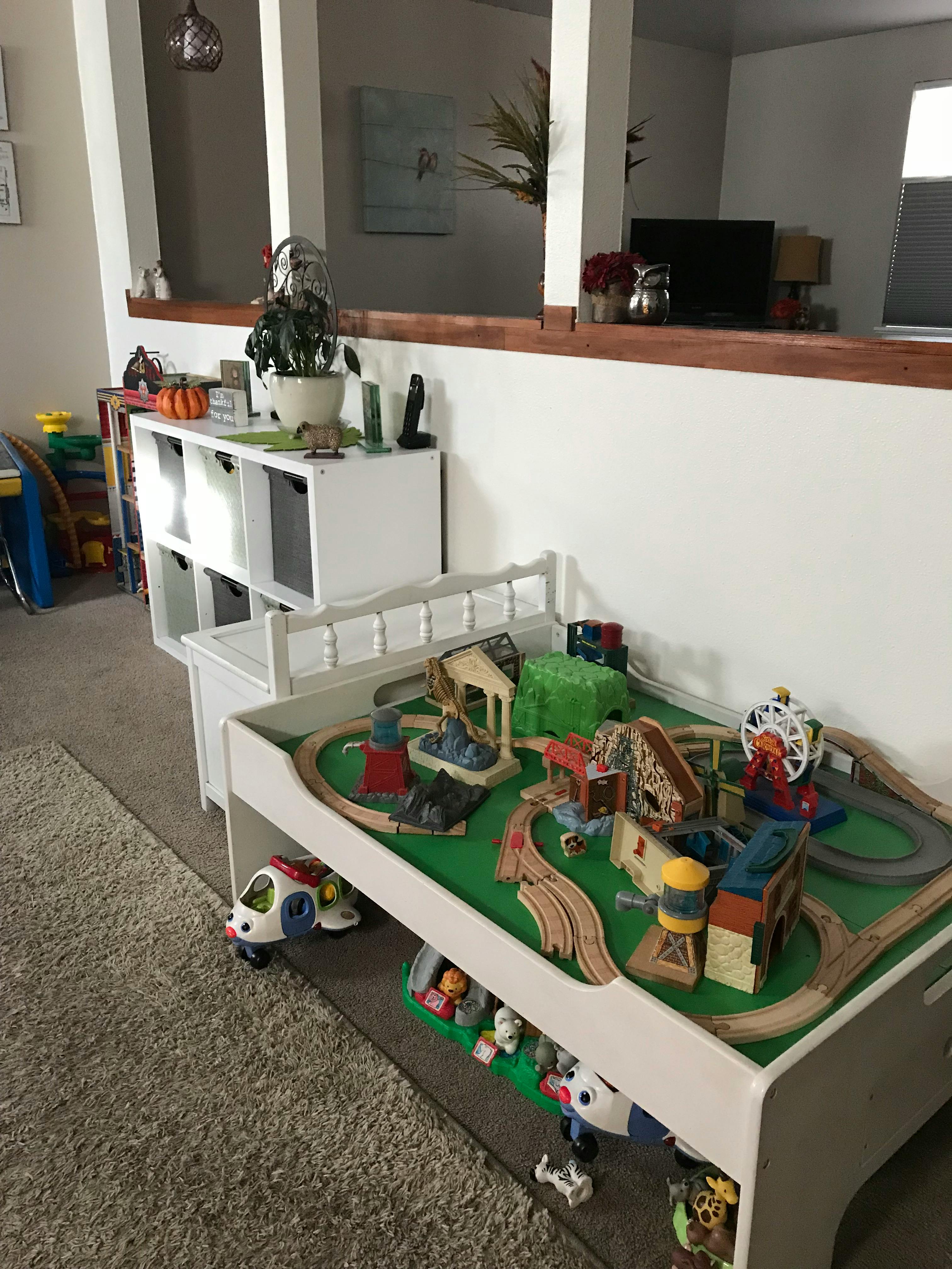 Toy train set on a play table in a room